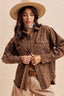 Front view of a women’s brown floral western shacket with snap buttons and chest pockets