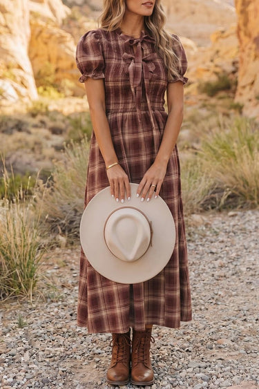 Red western plaid puff-sleeve midi dress styled with a cowgirl hat and brown boots