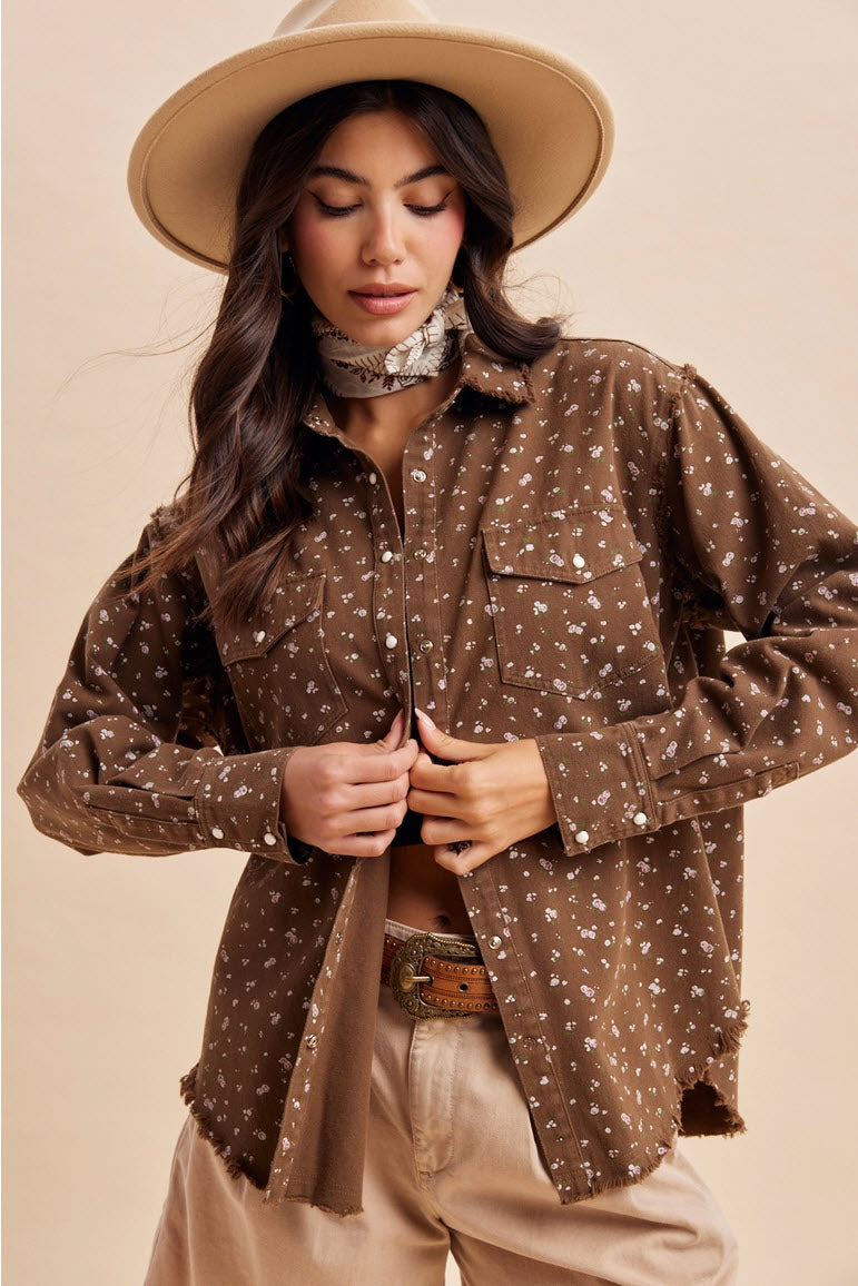 Front view of a women’s brown floral western shacket with snap buttons and chest pockets