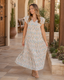 Buttercream floral button-down tie-waist maxi dress styled in a Southwestern boutique courtyard