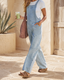 Women’s light blue wide-leg denim overalls pocket jumpsuit styled in a Southwestern setting